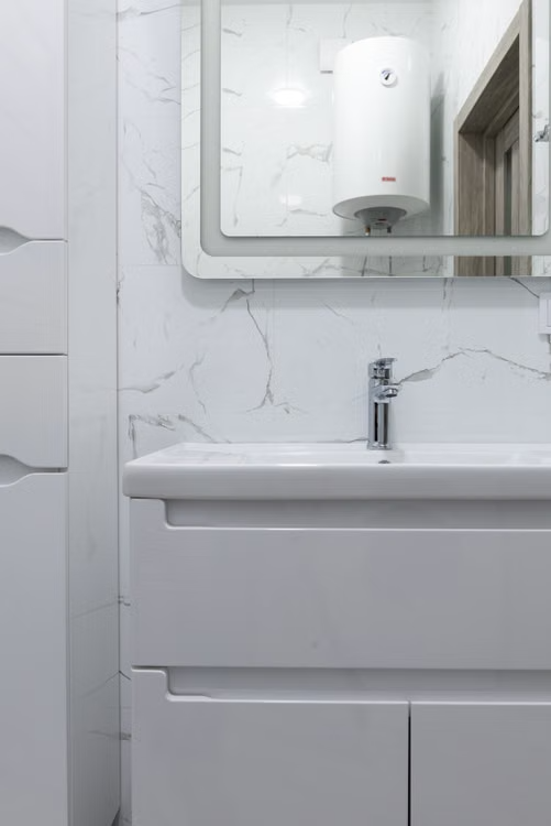 Modern bathroom with a tankless water heater installed for efficient hot water.